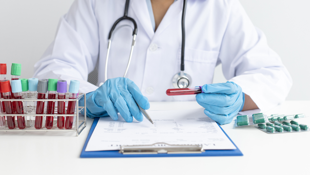 A doctor examines a blood test sample, demonstrating professionalism and diligence in a medical office.