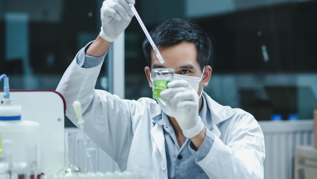 Scientist man is seriously researching the ingredients development for Herbal Medicine