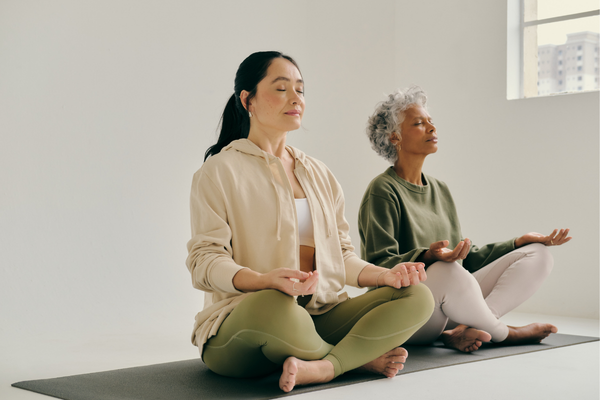 Woman practicing breathwork outdoors to support nervous system regulation