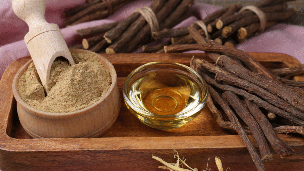 Dried licorice root and herbal tea on a wooden table