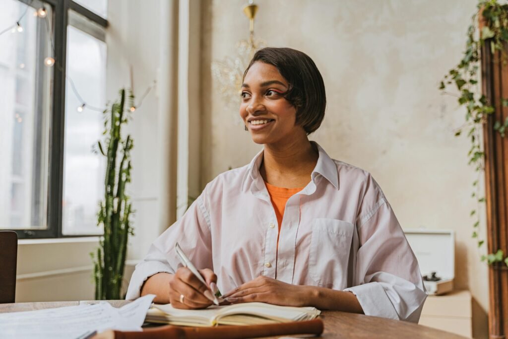 A confident young professional holding a notebook in a bright herbal clinic, surrounded by plants and natural remedies, representing a warm and holistic natural health career.